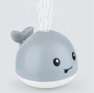 KOMAMY SPRINKLER WHALE BATH TOY WITH LED LIGHTS